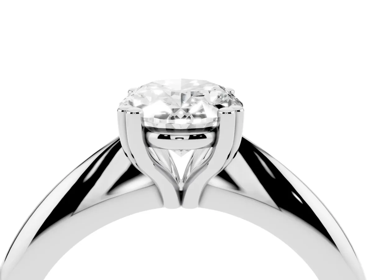 Oval Cut Cut Solitaire Engagement Ring with Tapered Band and Four-Prong Setting Silver