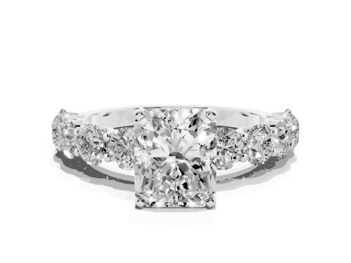 Radiant Cut Diamond Prong Setting with Side Stones on a Pave Band Silver