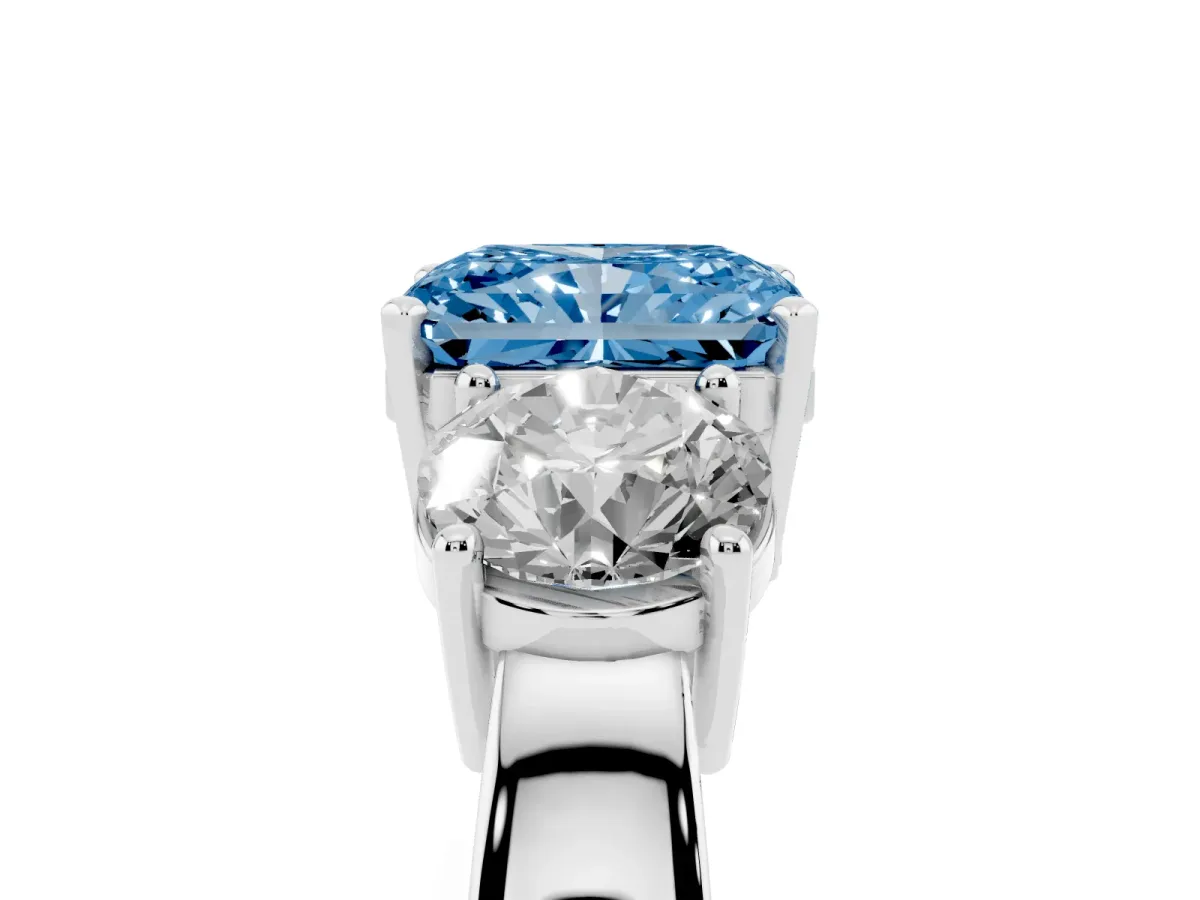 Fancy Blue Three-Stone Radiant Cut Diamond Ring with Round Side Stones, Classic Band, and Four-Prong Setting Platinum