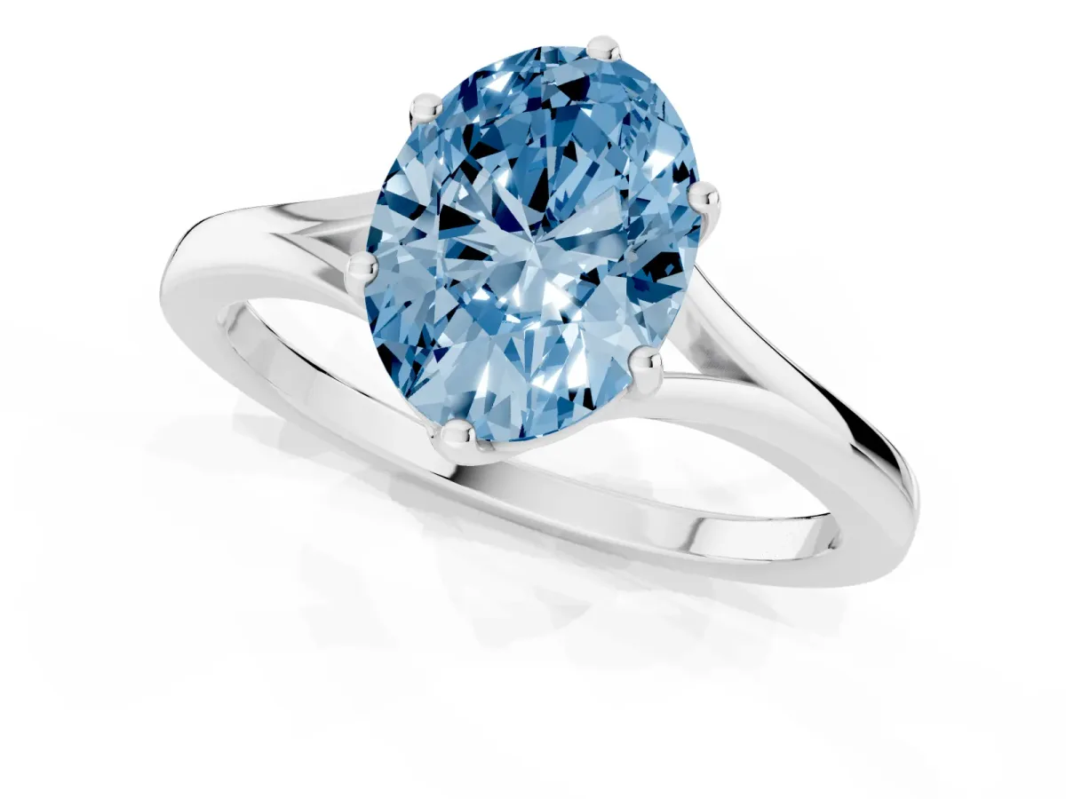 Fancy Blue Oval Cut Solitaire Diamond Ring with Six-Prong Setting and Tapered Band Silver