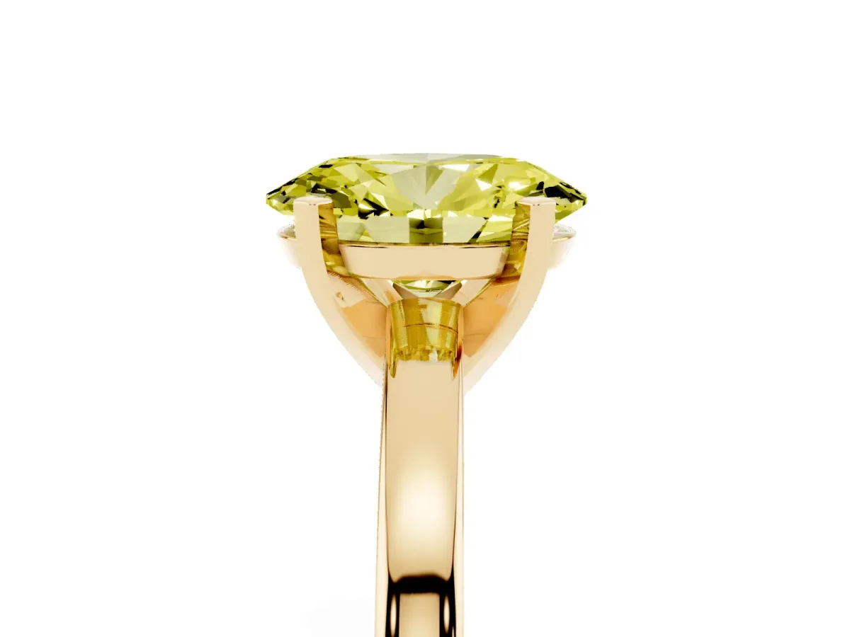 Fancy Yellow Oval Cut Solitaire Diamond Engagement Ring with Four-Prong Setting on a Classic Band Yellow gold