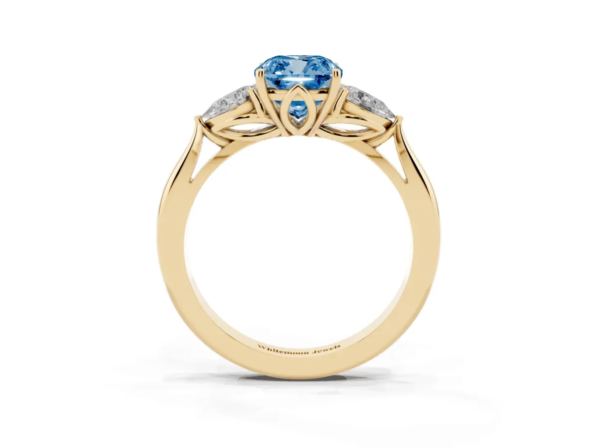 Fancy Blue Three-Stone Cushion Cut Brilliant Diamond Solitaire Ring with Tapered Band and Four-Prong Setting Yellow gold