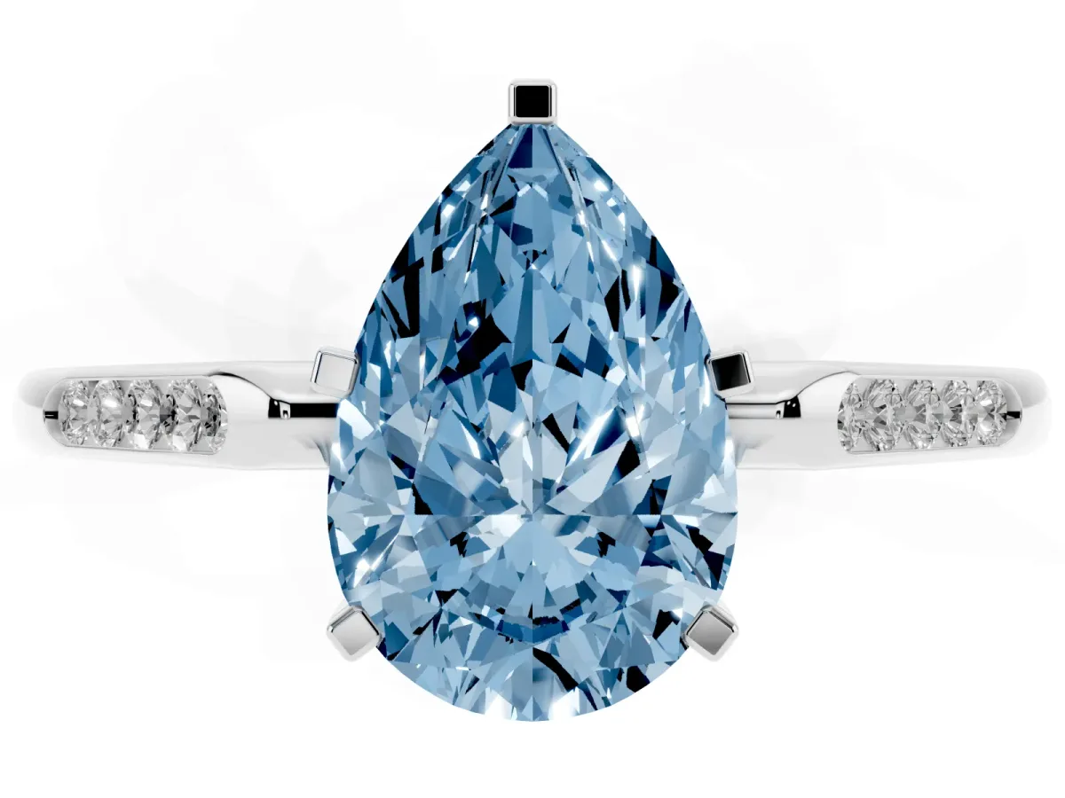 Fancy Blue Pear Cut Diamond Solitaire Ring with Channel Set Round Band and Prong Setting Silver