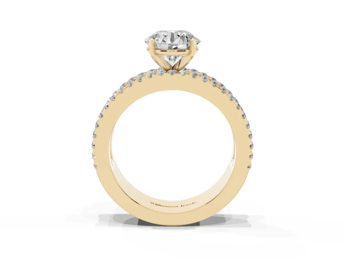 Round Cut Diamond Solitaire Ring with Pavé and Channel Set Band Yellow gold