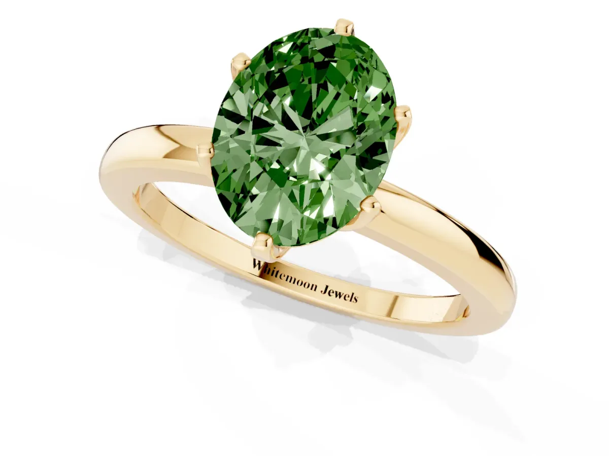 Fancy Green Oval Cut Solitaire Diamond Ring with Six-Prong Setting on a Classic Band Yellow gold