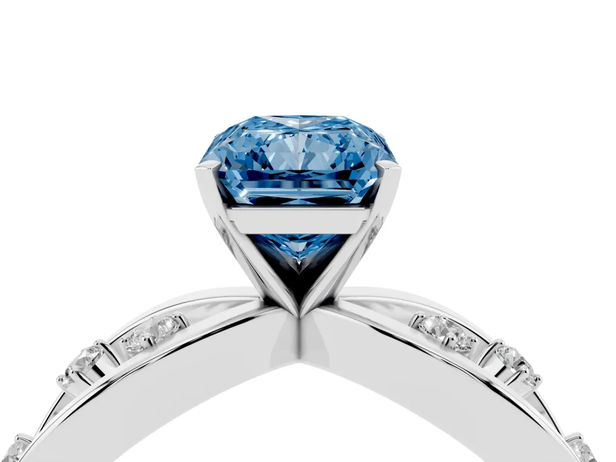 Fancy Blue Radiant Cut Cut Solitaire Diamond with Side Stones on Criss-Cross Band and Four-Prong Setting Platinum