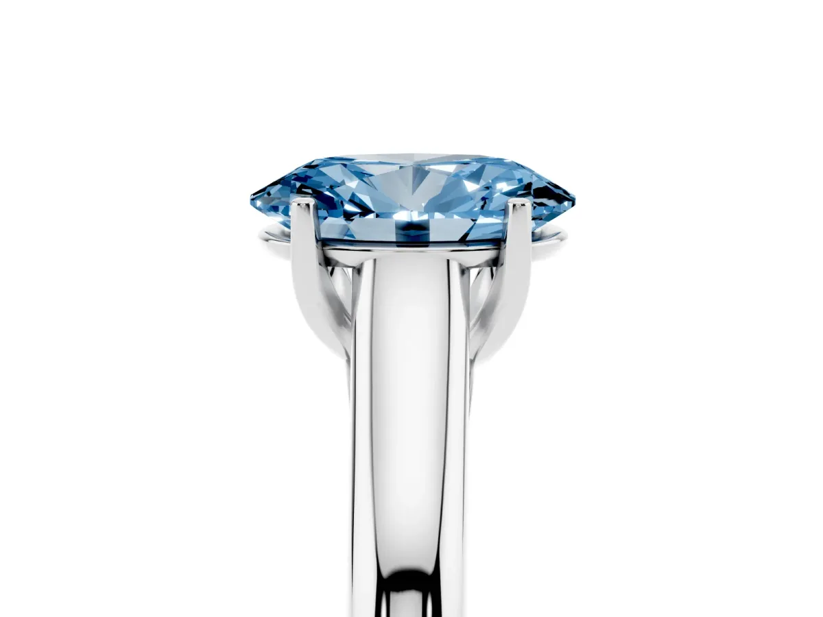 Fancy Blue Oval Cut Solitaire Engagement Ring with Tapered Band and Four-Prong Setting Silver