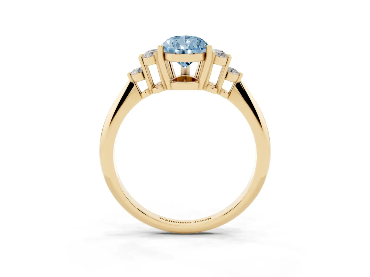 Fancy Blue Pear Cut Cut Diamond Cluster Ring with Solitaire Band and Four-Prong Setting Yellow gold