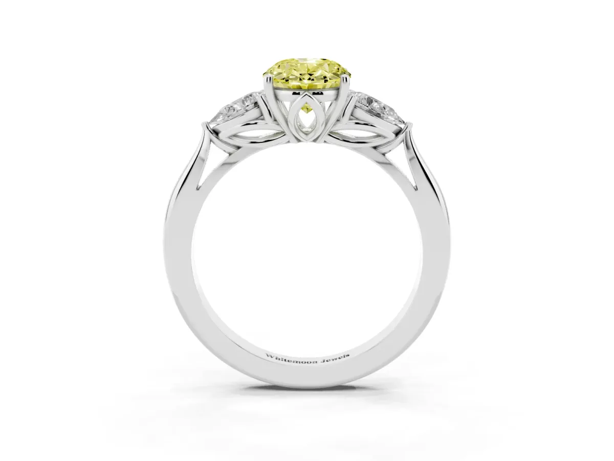 Fancy Yellow Three-Stone Oval Cut Brilliant Diamond Solitaire Ring with Tapered Band and Four-Prong Setting Silver