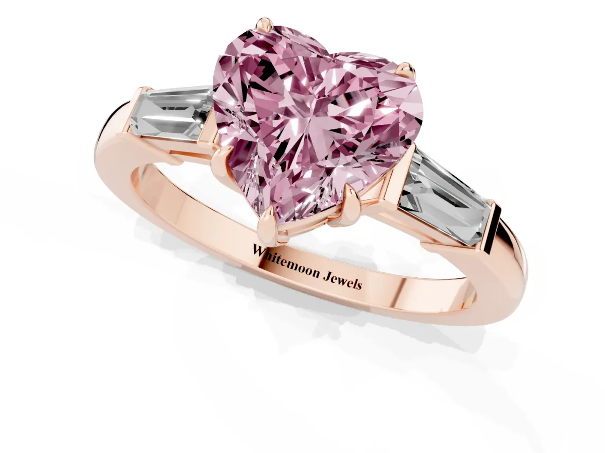 Fancy Pink Heart Cut Diamond Three-Stone Ring with Tapered Baguette Side Stones and Prong Setting Rose gold