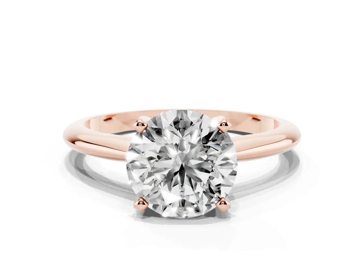Round Cut Cut Solitaire Ring with Four-Prong Setting on a Classic Band Rose gold