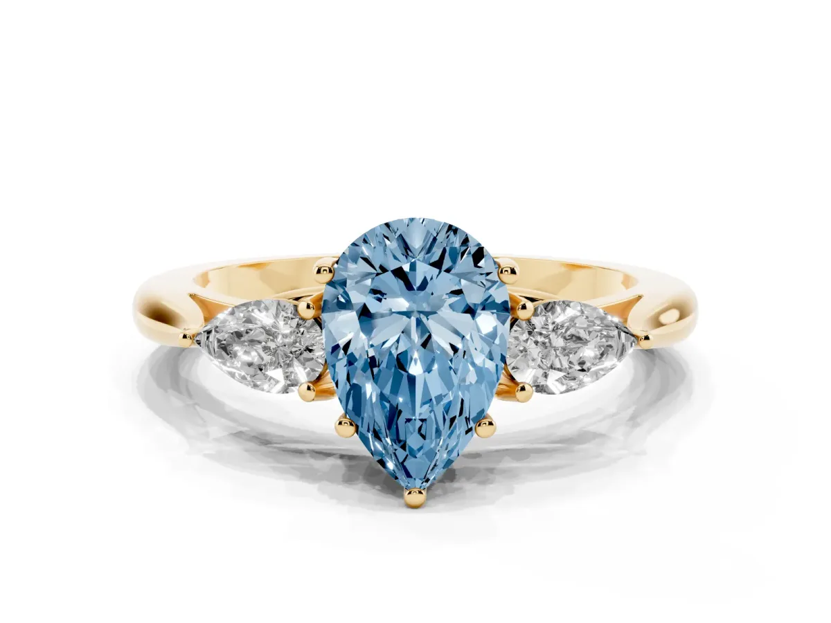 Fancy Blue Pear Cut Diamond Three-Stone Ring with Pear Side Stones and Prong Setting Yellow gold