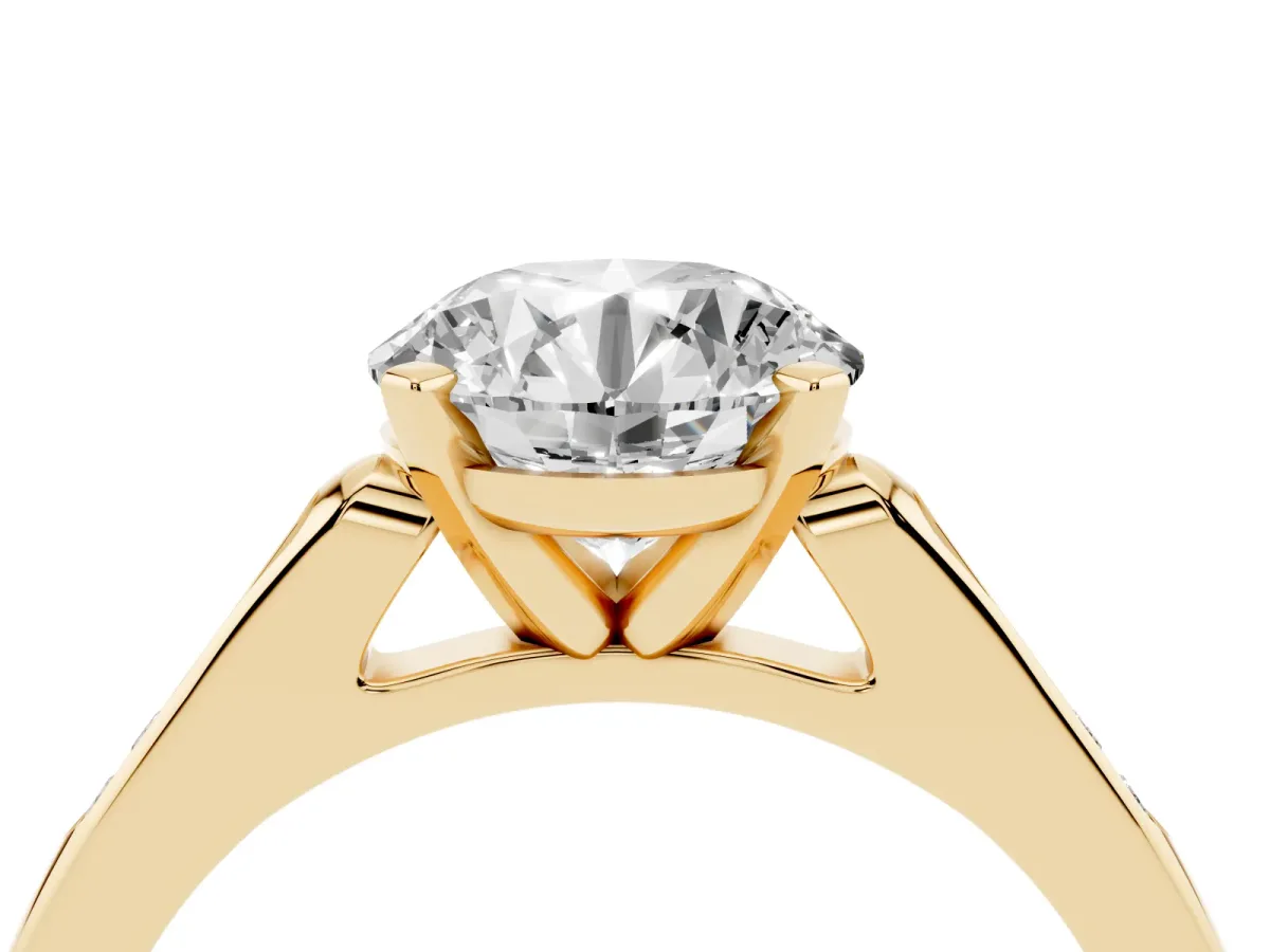 Round Cut Diamond Solitaire Ring with Channel Set Round Band and Prong Setting Yellow gold