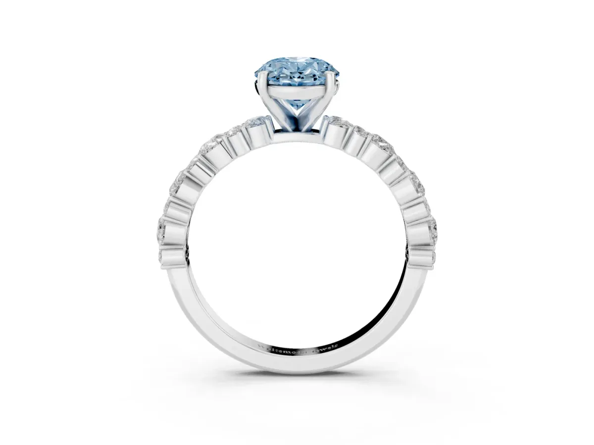 Fancy Blue Oval Cut Diamond Side Stone Solitaire Ring with Round and Four-Prong Setting Silver