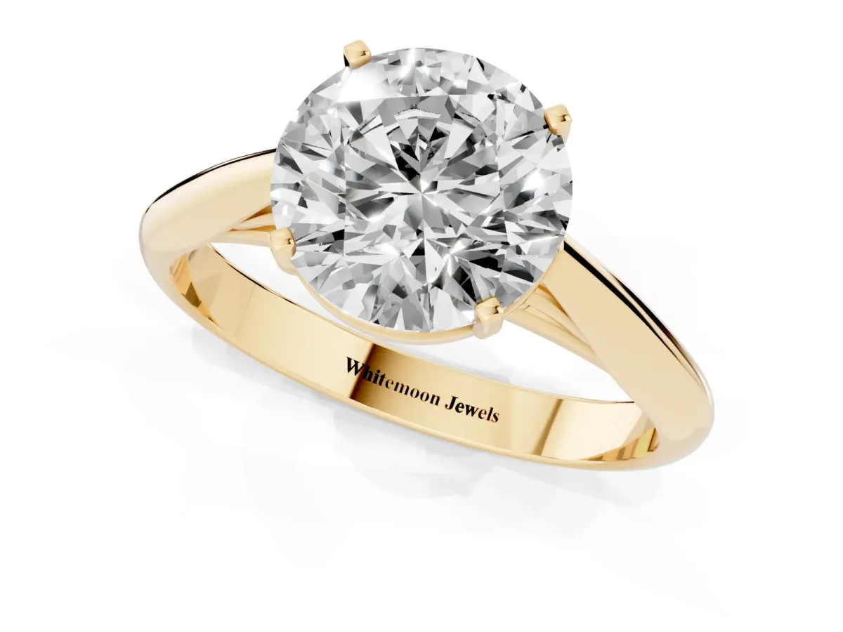 Round Cut Diamond Solitaire Engagement Ring with Cathedral Setting and Four-Prong Mount Yellow gold