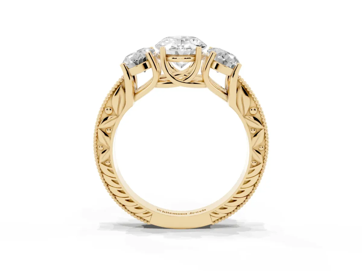 Three-Stone Oval Cut Cut Milgrain Pavé Engagement Ring Yellow gold
