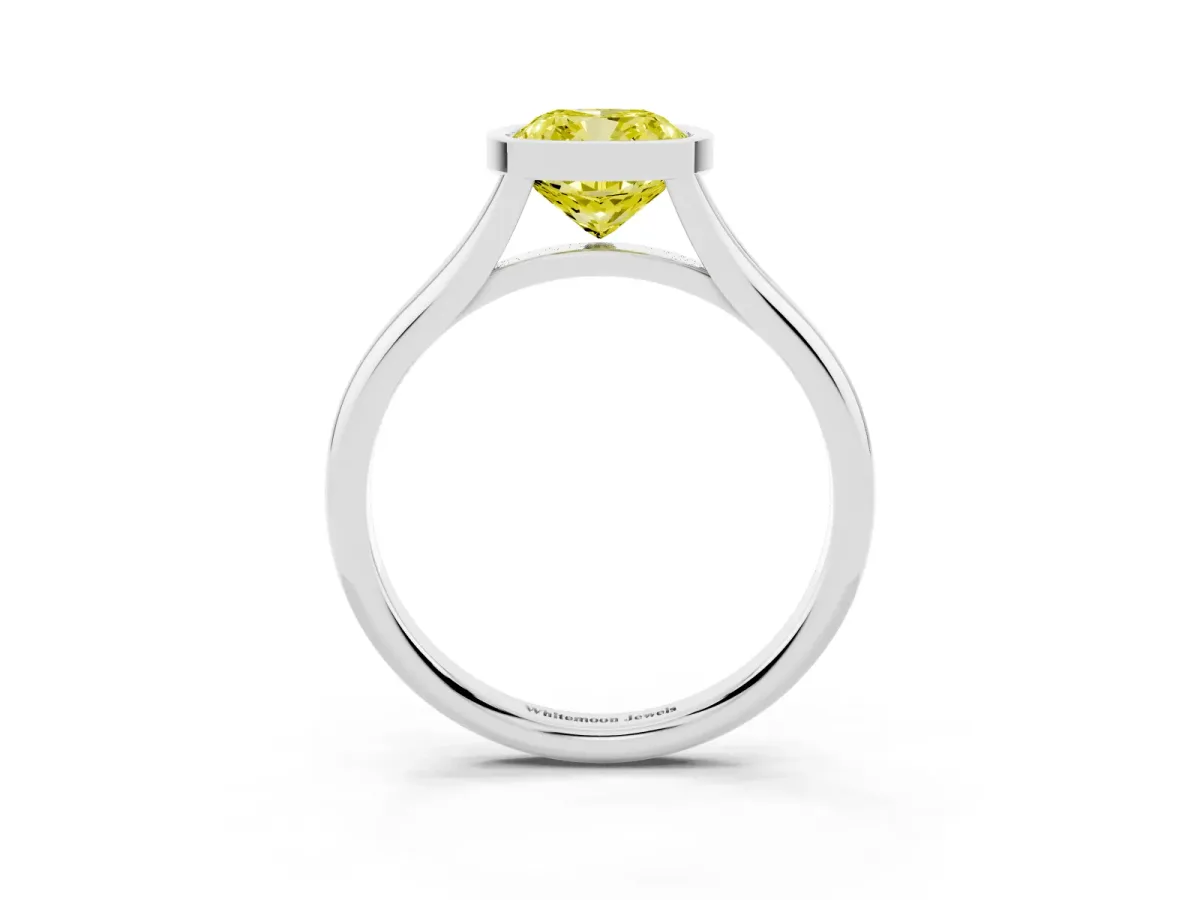 Fancy Yellow Bezel Set Cushion Cut Cut Solitaire Ring with Tapered Band White gold