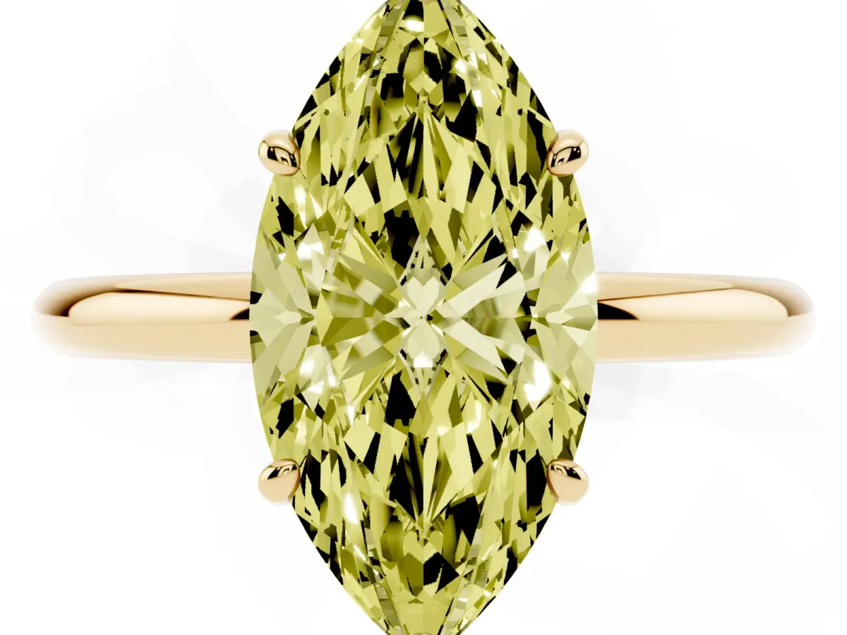 Fancy Yellow Oval Cut Solitaire Diamond Ring with Four-Prong Setting on a Plain Band Yellow gold