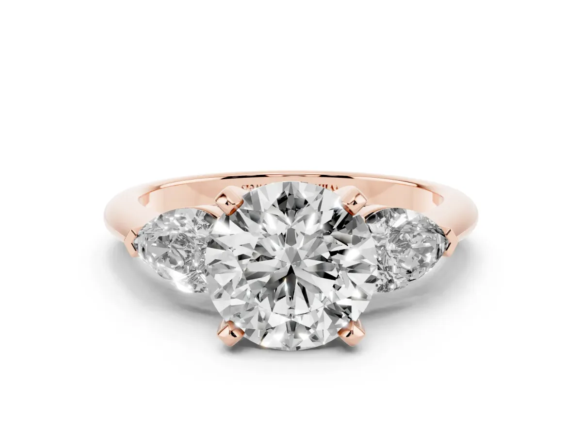 Three-Stone Round Cut Diamond Ring with Pear Side Stones and Four-Prong Setting Rose gold
