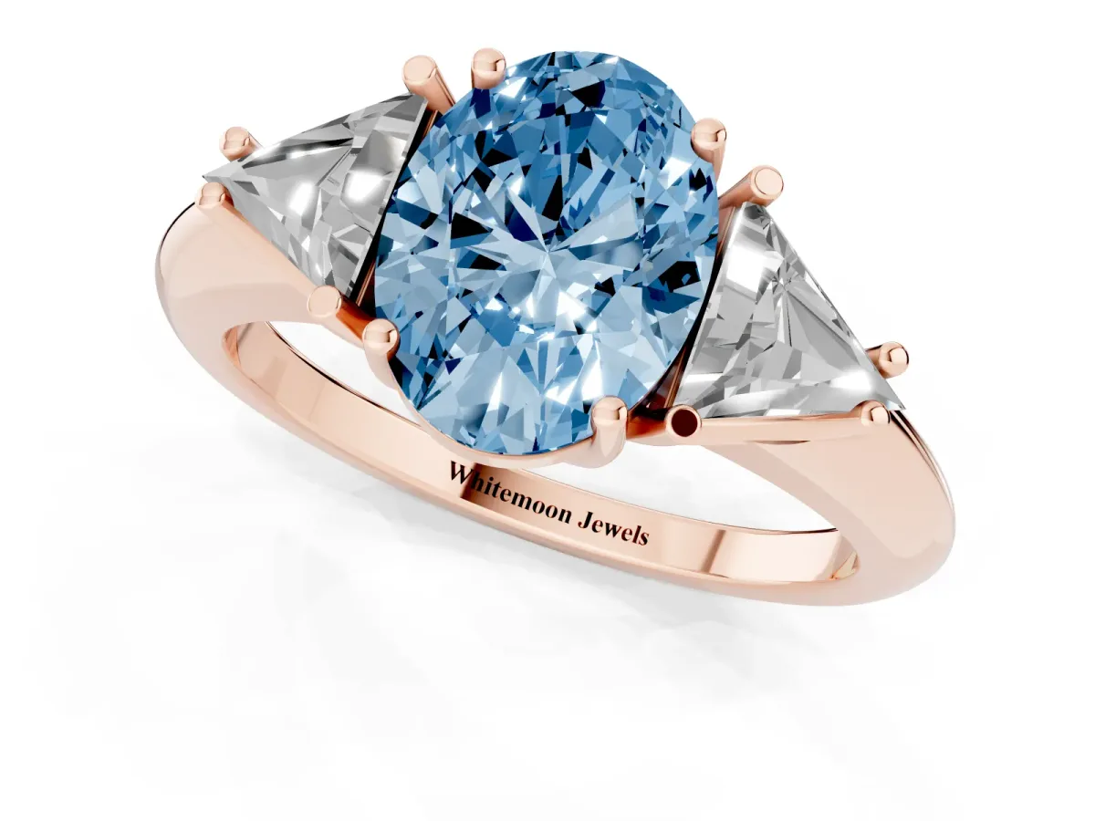 Fancy Blue Three-Stone Oval Cut Diamond Engagement Ring with Trillion Side Stones and Prong Setting Rose gold
