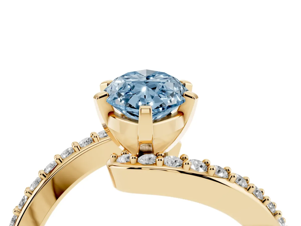 Fancy Blue Marquise Cut Solitaire Twist Band with Pave Set Diamonds and Four-Prong Setting Yellow gold