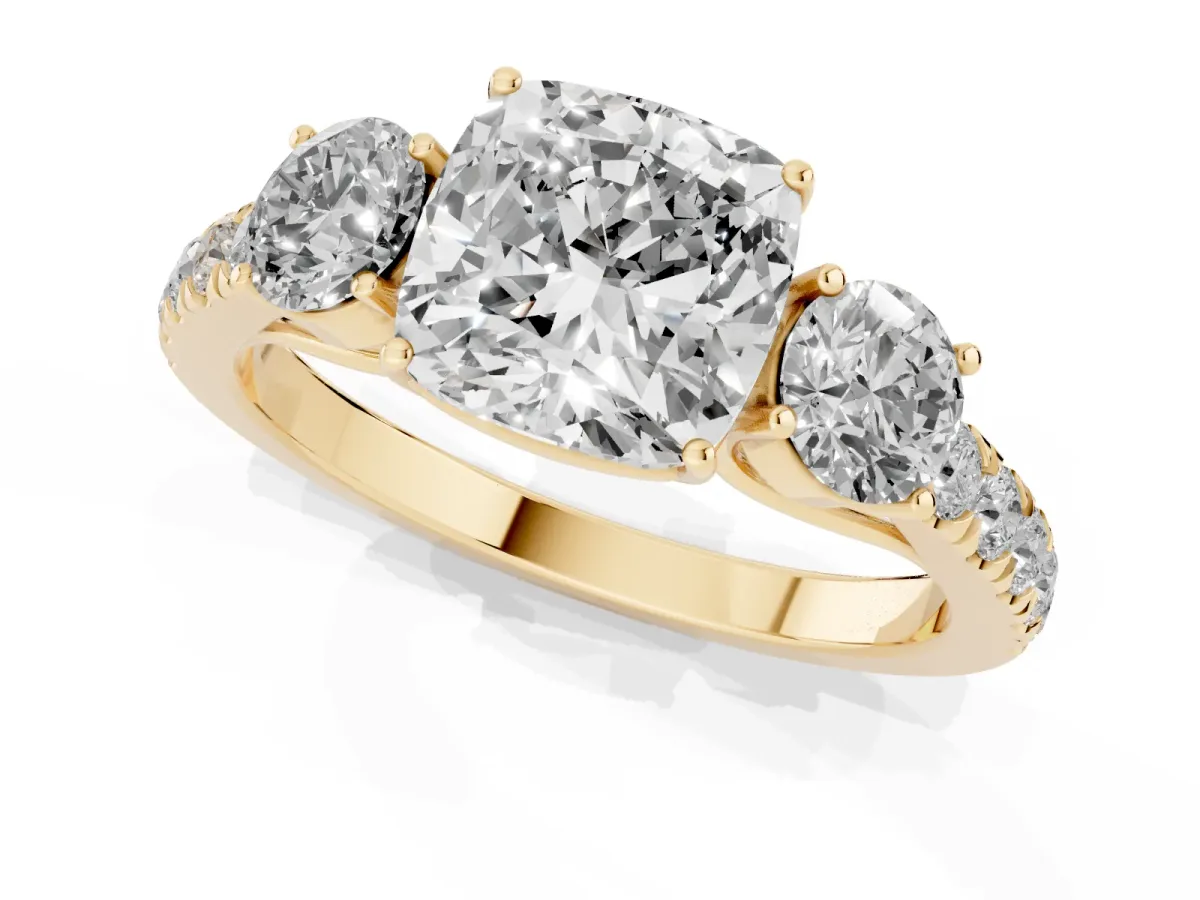 Cushion Cut Cut Diamond Three-Stone Ring with Round Side Stones and Pavé Band Yellow gold