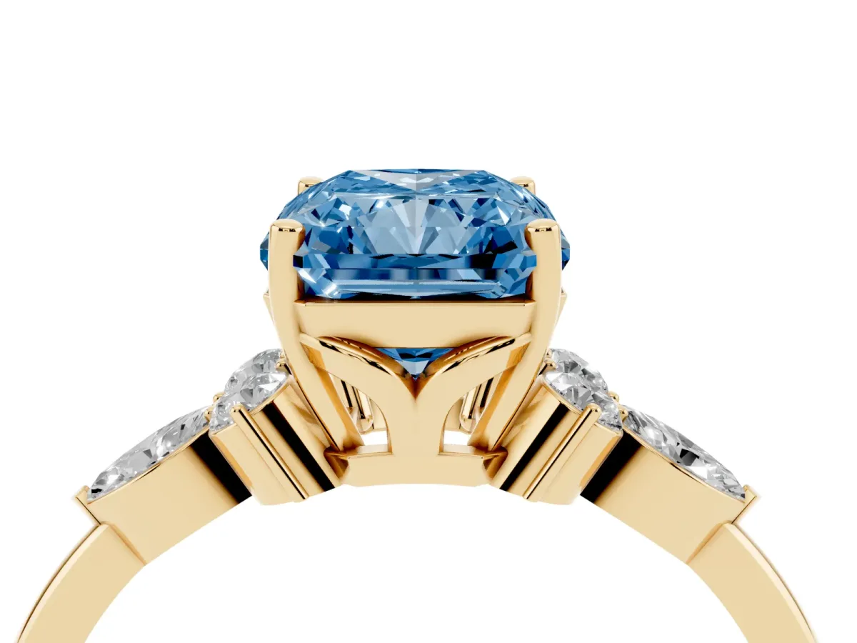 Fancy Blue Radiant Cut Brilliant Diamond Solitaire Ring with Pear Side Stones and Four-Prong Setting Yellow gold