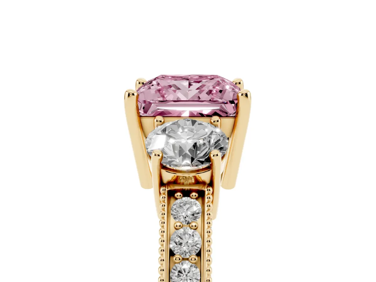 Fancy Pink Princess Cut Three-Stone Diamond Ring with Pavé Band and Four-Prong Setting Yellow gold