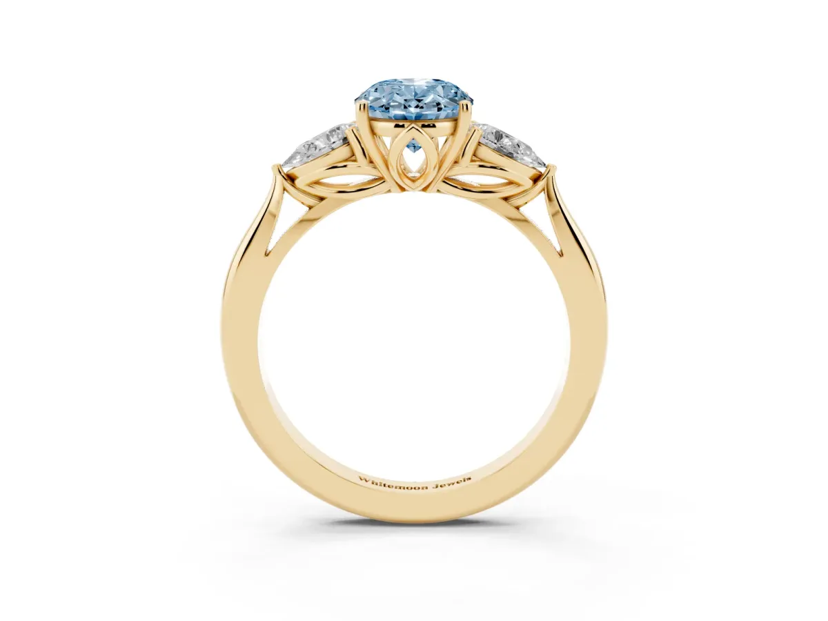 Fancy Blue Oval Cut Diamond Three-Stone Ring with Pear Side Stones and Prong Setting Yellow gold