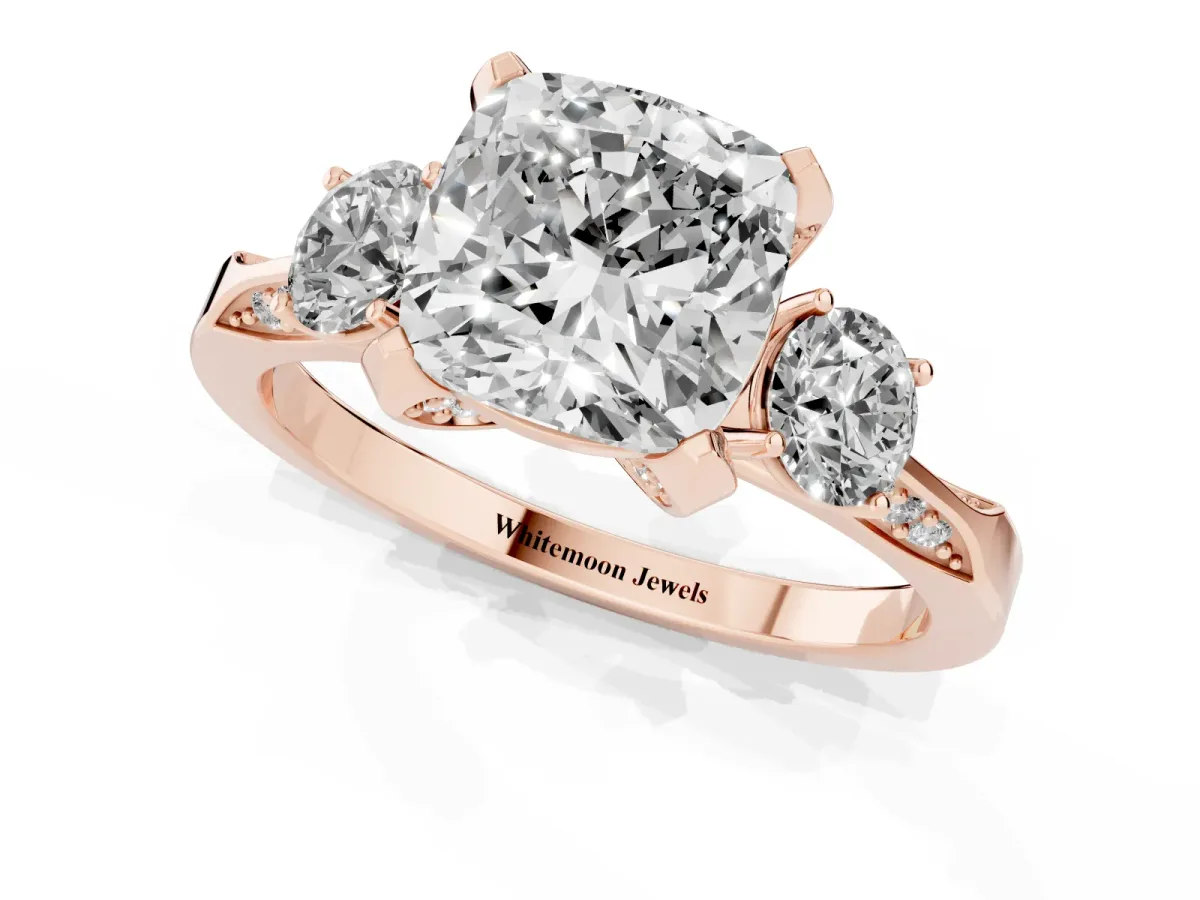 Cushion Cut Brilliant Three-Stone Diamond Ring with Pavé Band and Four-Prong Setting Rose gold