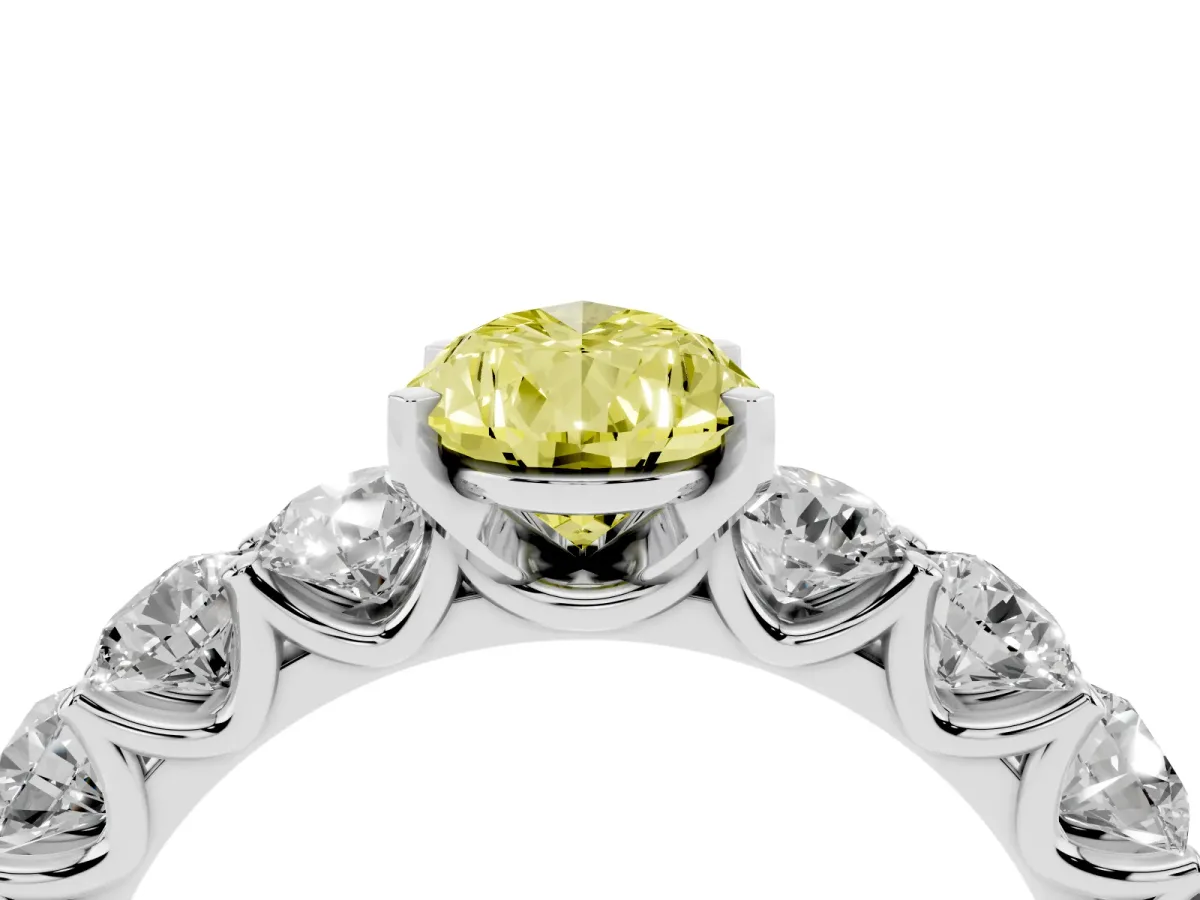 Fancy Yellow Pear Cut Diamond Prong Setting with Side Stones on a Pave Band Silver