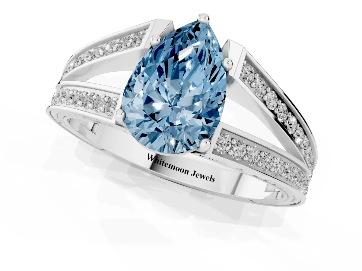 Fancy Blue Pear Cut Diamond Split Shank Ring with Pavé Band and Four-Prong Setting Silver