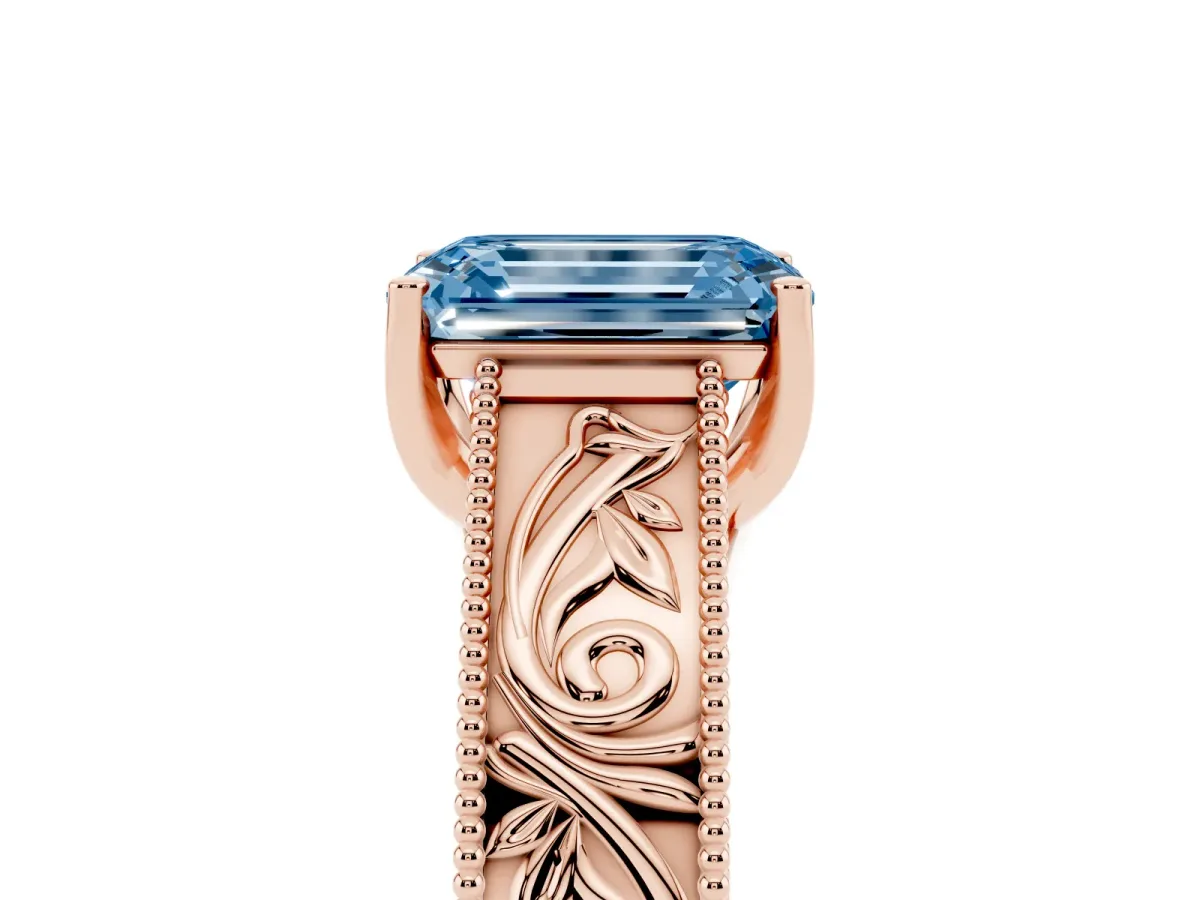 Fancy Blue Emerald Cut Diamond Solitaire Ring with Engraved Band and Four-Prong Setting Rose gold