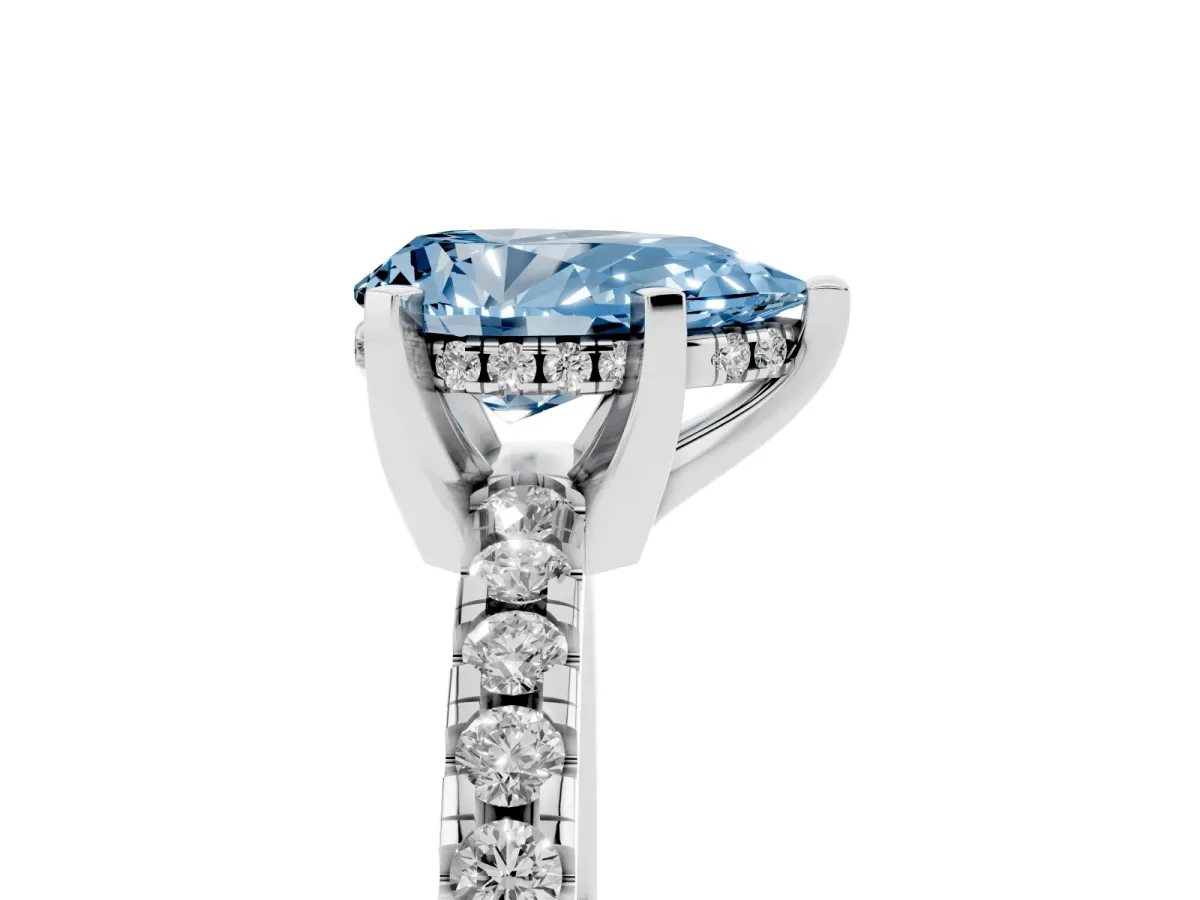 Fancy Blue Pear Cut Diamond Solitaire Ring with Round Pavé Band and Four-Prong Setting Silver