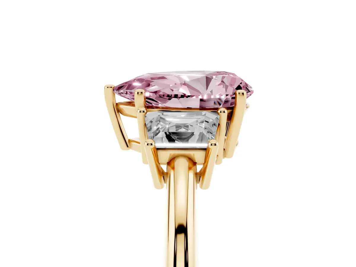 Fancy Pink Pear Cut Diamond Three-Stone Ring with Trapezoid Side Stones and Prong Setting Yellow gold