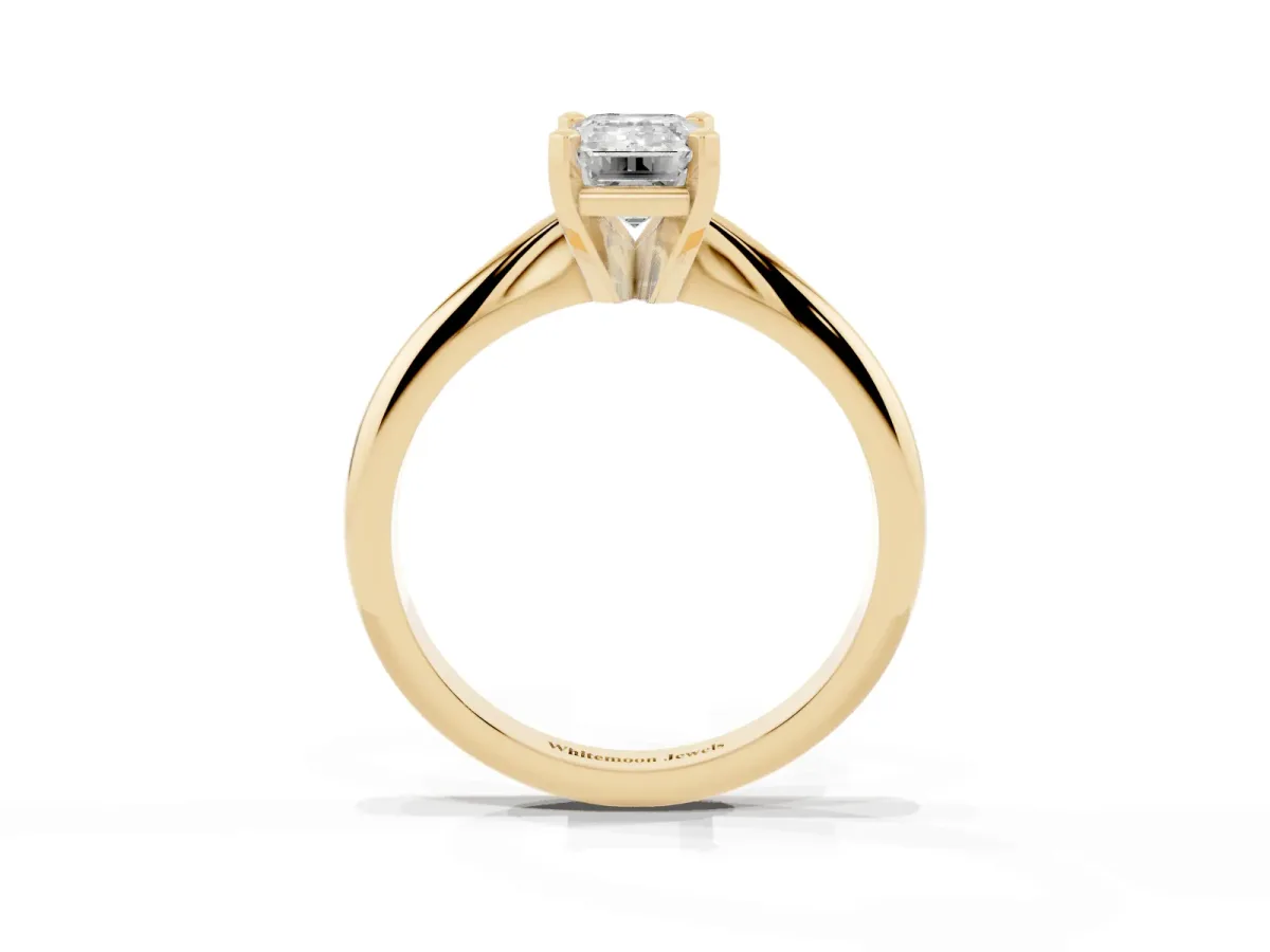 Emerald Cut Cut Solitaire Ring with Four-Prong Setting on a Classic Band Yellow gold
