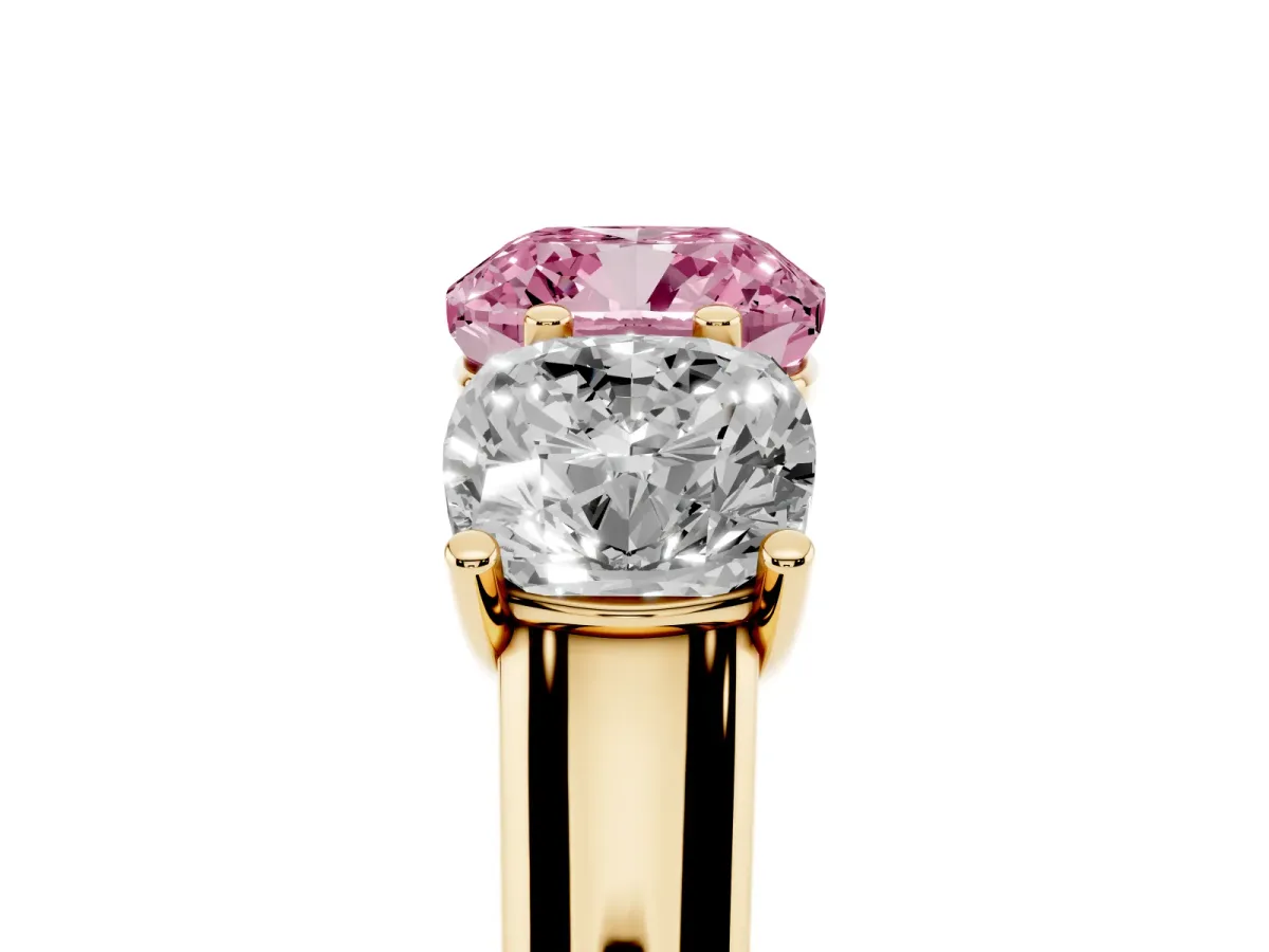 Fancy Pink Cushion Cut Three-Stone Diamond Ring with Prong Setting on a Classic Band Yellow gold