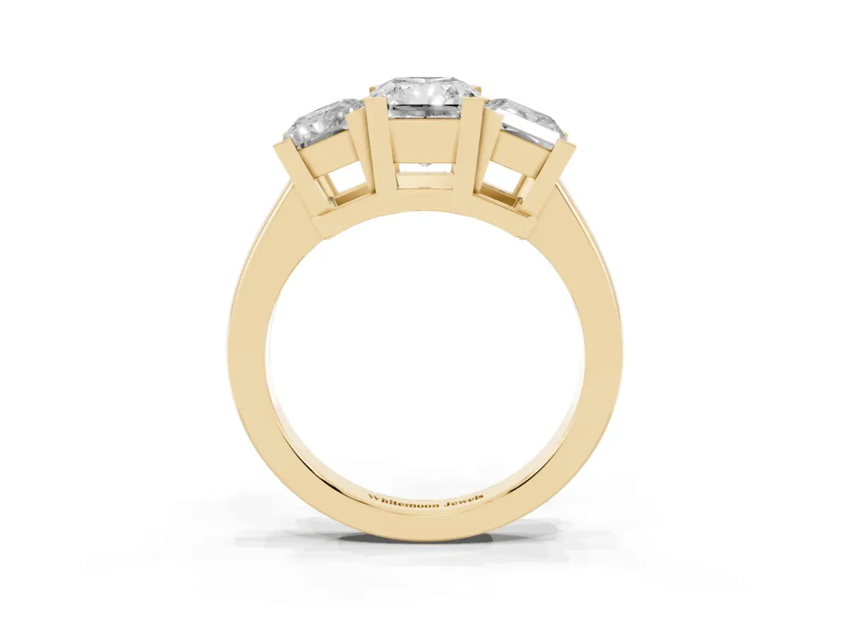 Three-Stone Radiant Cut Cut Diamond Ring with Channel Set Band and Four-Prong Setting Yellow gold