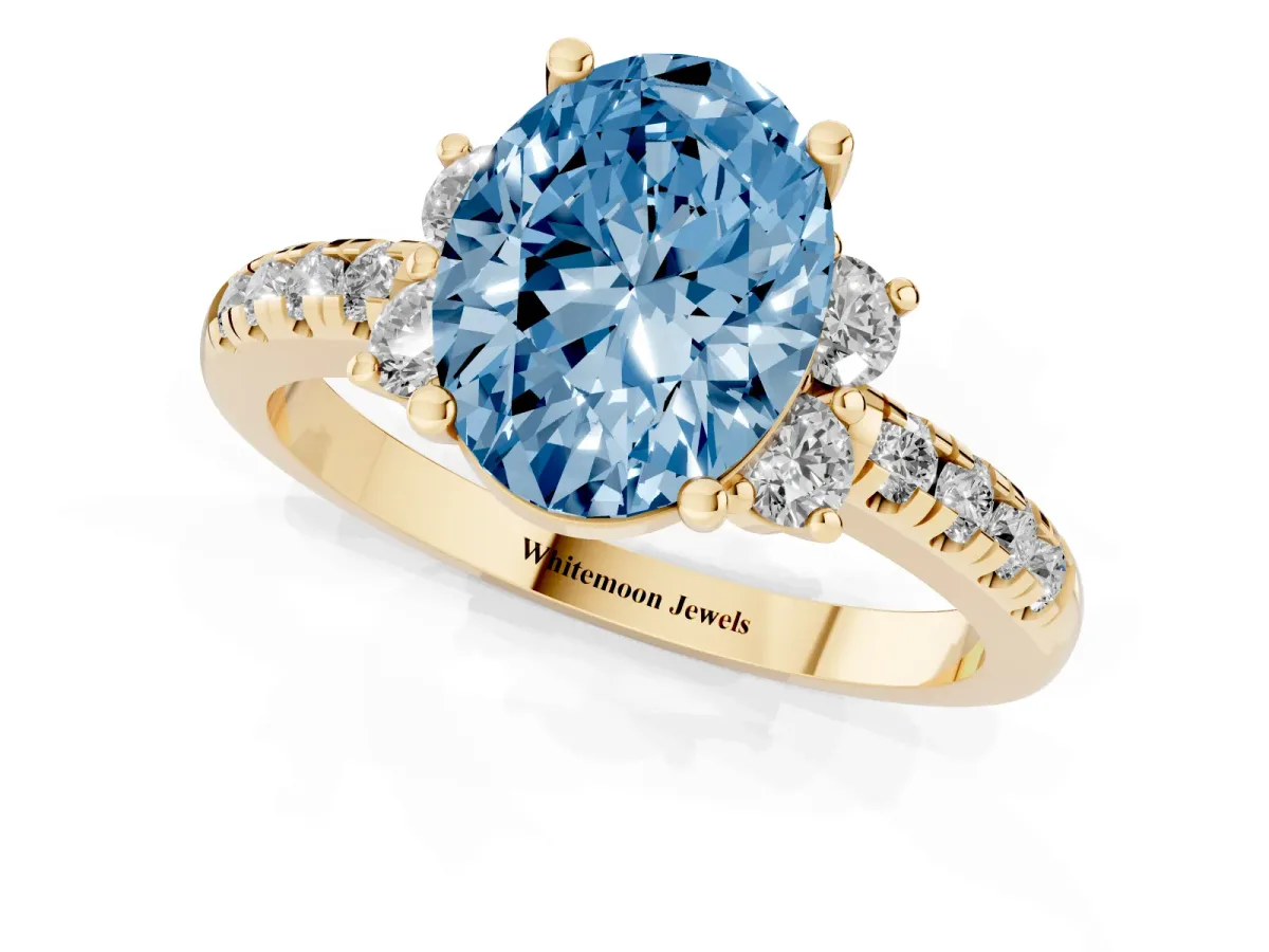 Fancy Blue Oval Cut Diamond Three-Stone Pave Band with Four-Prong Setting Yellow gold