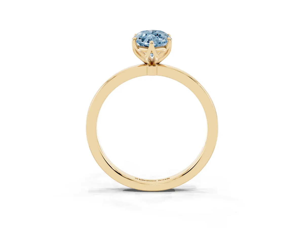 Fancy Blue Marquise Cut Diamond Solitaire Ring with Thin Band and Prong Setting Yellow gold
