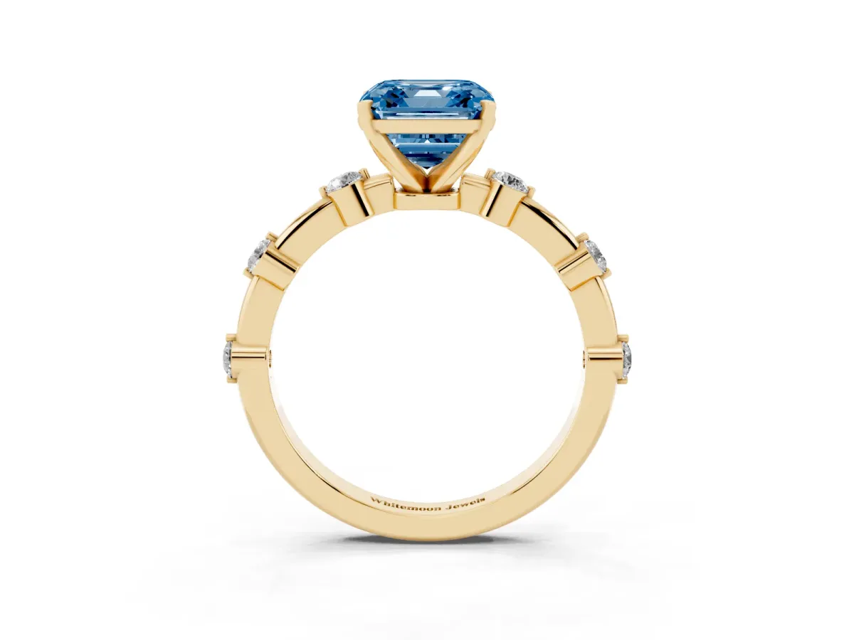 Fancy Blue Asscher Cut Solitaire Diamond Ring with Bezel Set Side Stones and Prong Setting Yellow gold