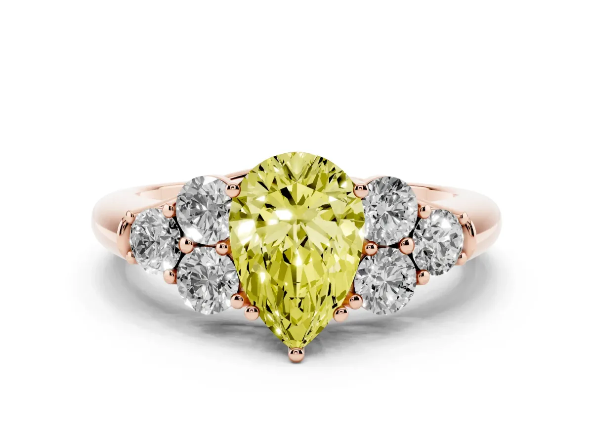 Fancy Yellow Pear Cut Cut Diamond Cluster Ring with Round Accent Stones and Prong Setting on a Classic Band Rose gold