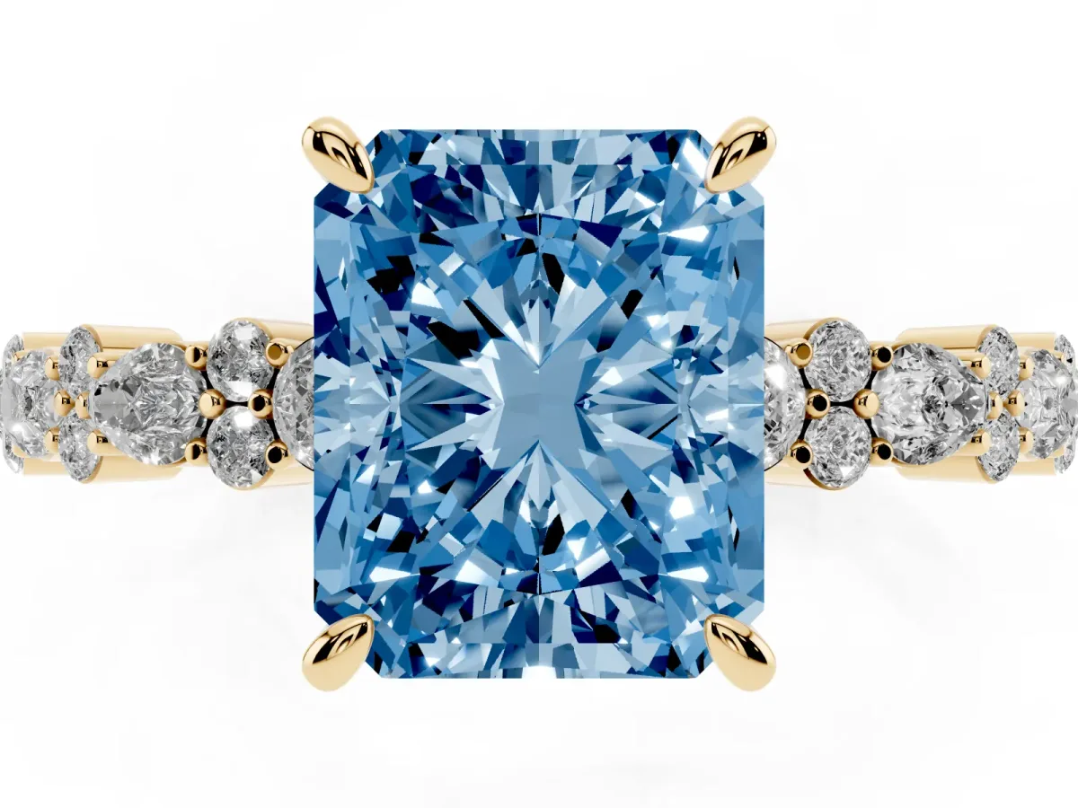 Fancy Blue Radiant Cut Diamond Side Stone Solitaire Ring with Round and Four-Prong Setting Yellow gold