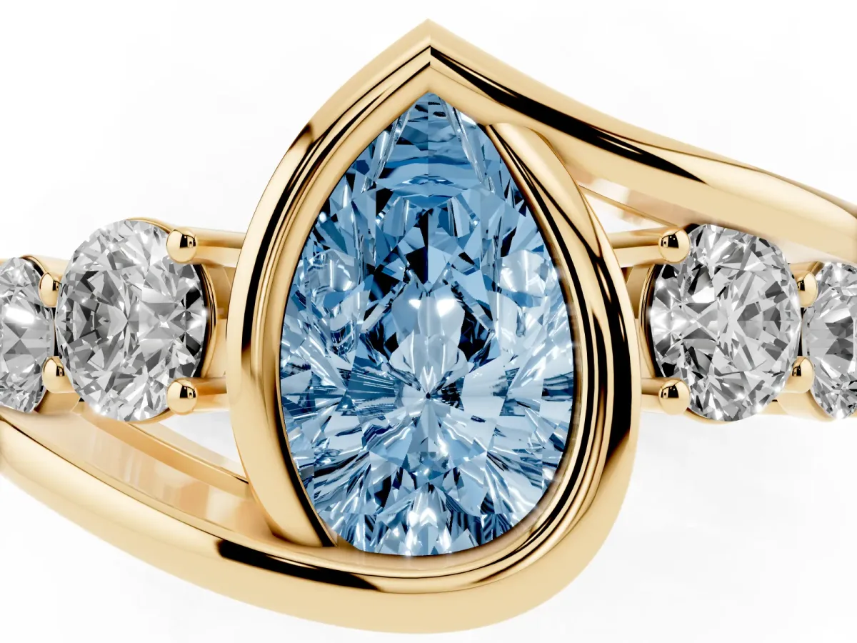 Fancy Blue Bezel Set Pear Cut Diamond Bypass Ring with Round Accents Yellow gold