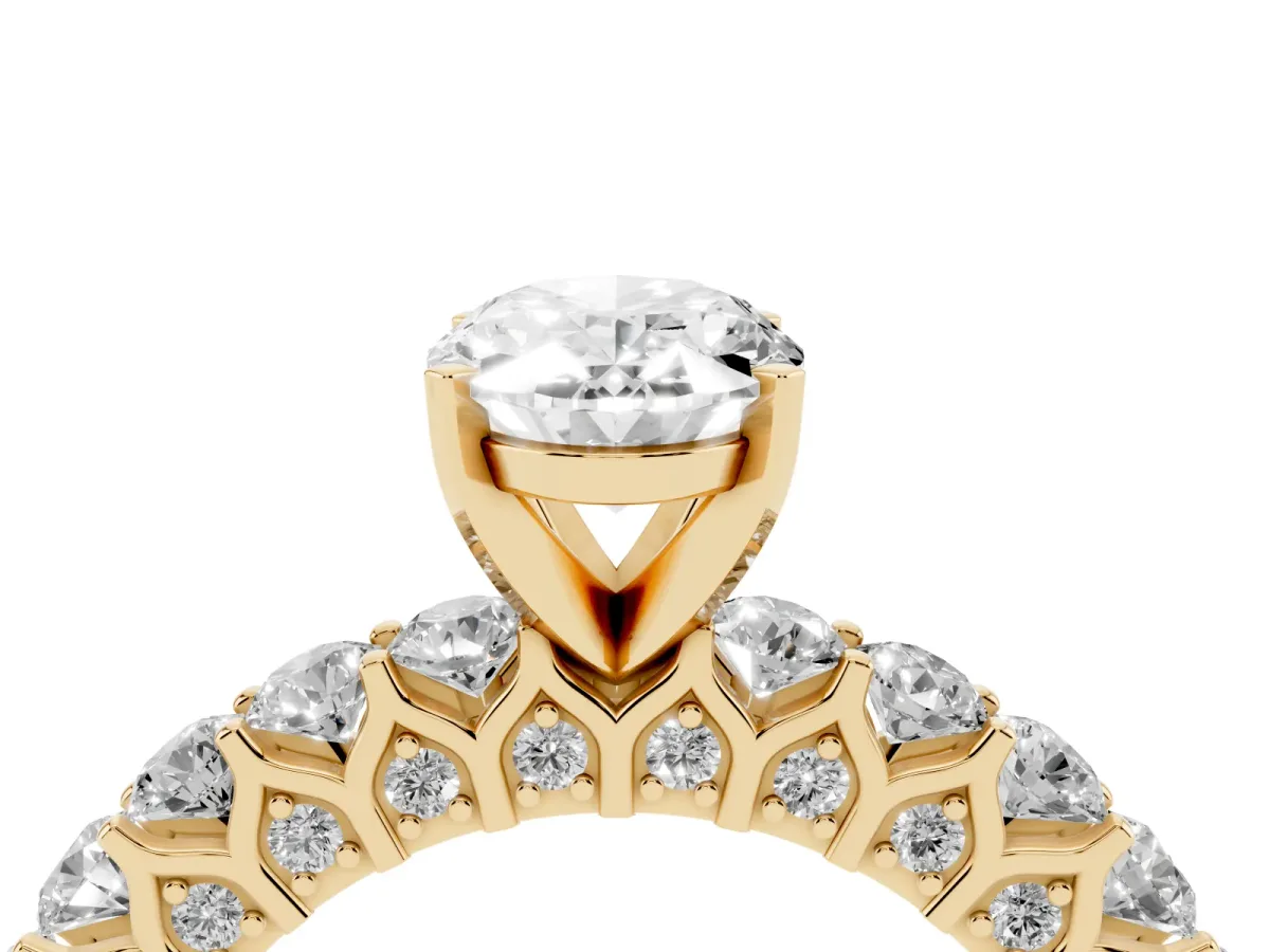 Oval Cut Diamond Solitaire Ring with Shared Prong Pavé Band and Four-Prong Setting Yellow gold