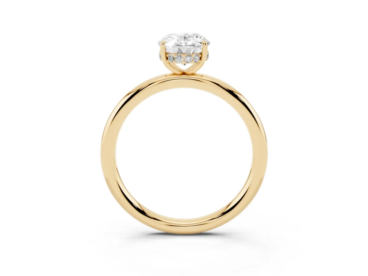 Oval Cut Diamond Solitaire Ring with Thin Band and Four-Prong Setting Yellow gold