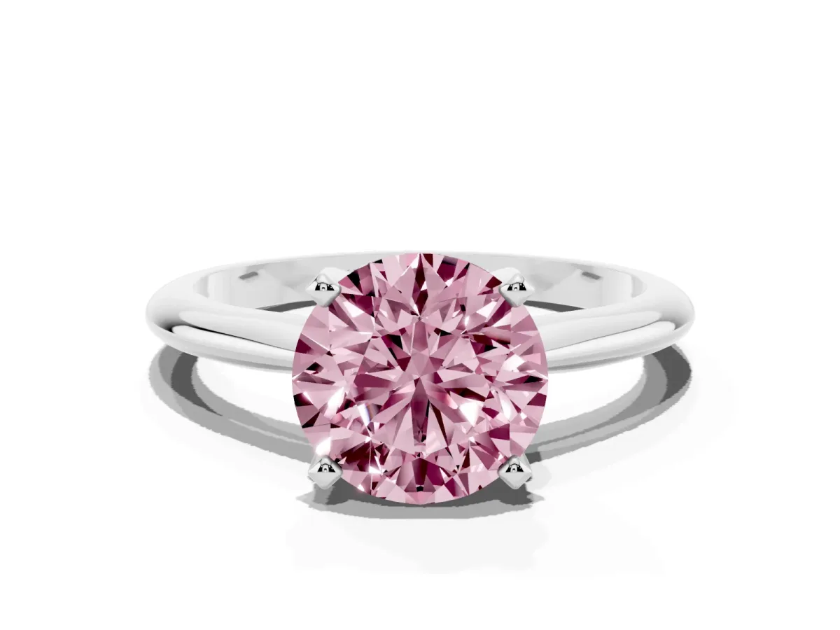 Fancy Pink Round Cut Cut Solitaire Ring with Four-Prong Setting on a Classic Band Silver