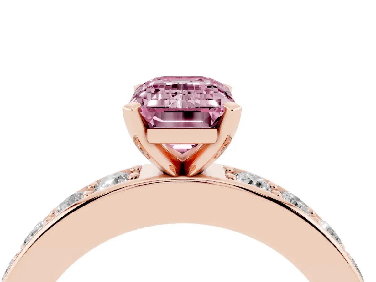 Fancy Pink Emerald Cut Diamond Engagement Ring with Channel Set Round Band and Prong Setting Rose gold
