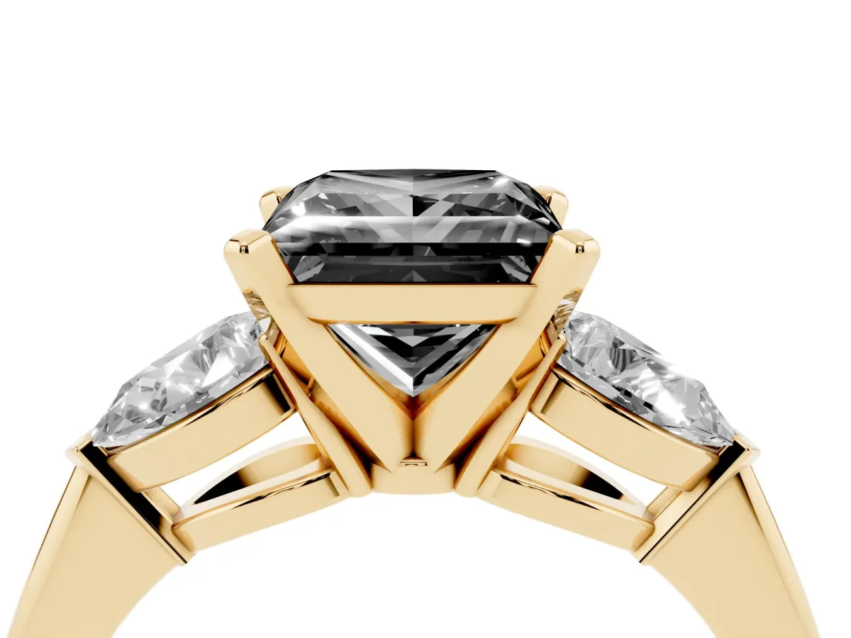 Fancy Black Three-Stone Princess Cut Diamond Ring with Pear Side Stones and Four-Prong Setting Yellow gold
