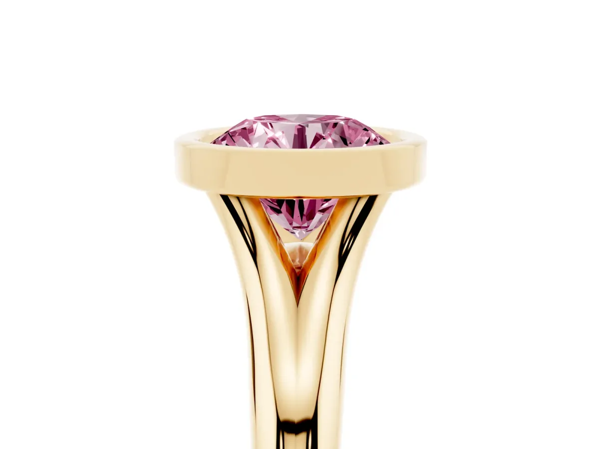 Fancy Pink Bezel Set Round Cut Solitaire Diamond Ring with Smooth Band Yellow gold